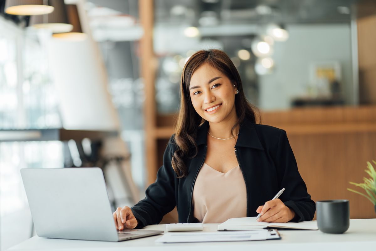 Business woman smiling in an office